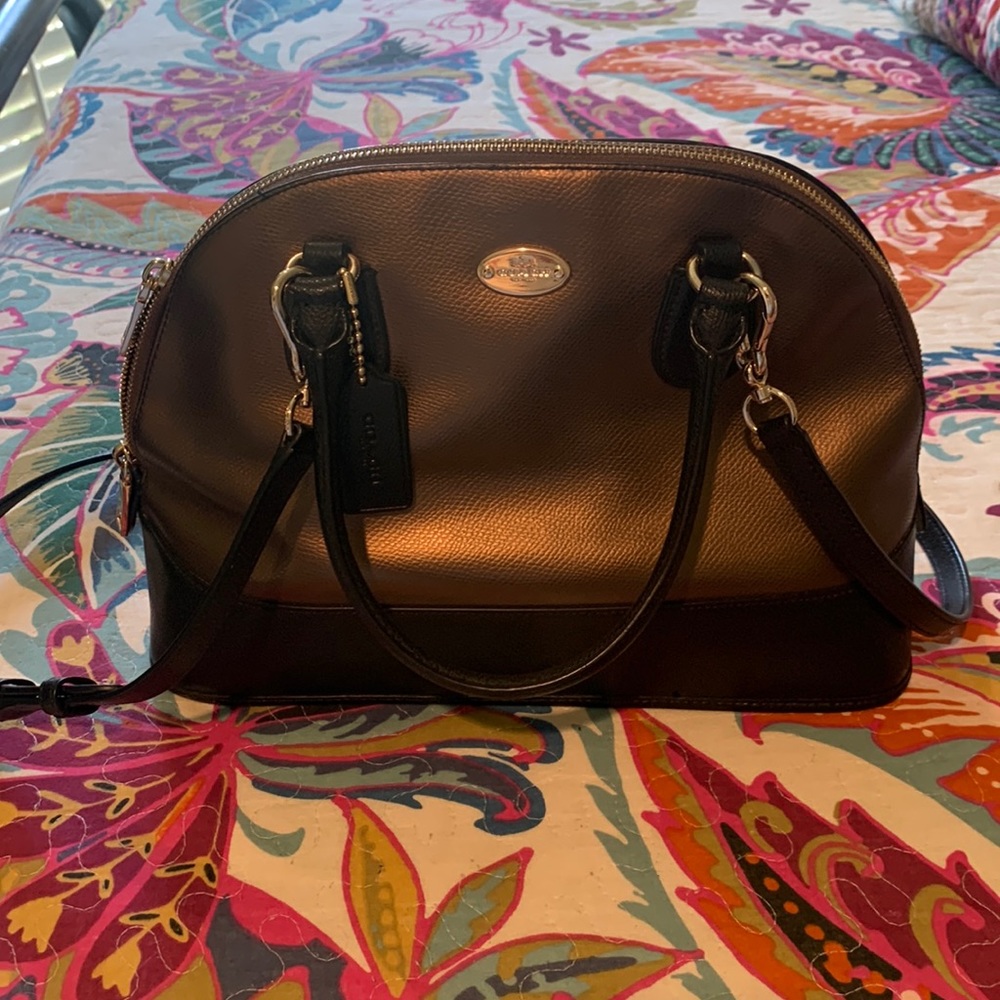 Bronze and black coach handbag with should strap
